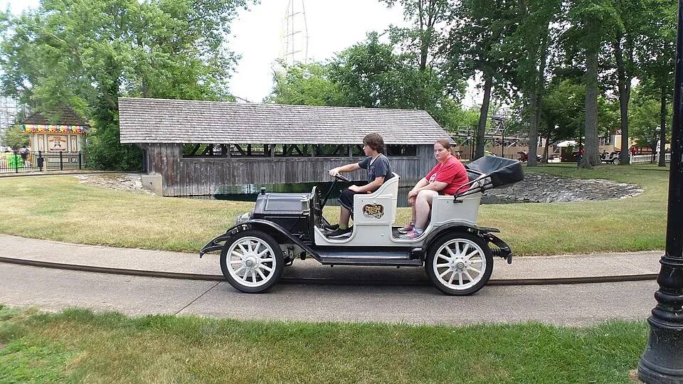 Riders in a vintage antique car on the Jalopy Junction ride — kids carnival ride rental Los Angeles