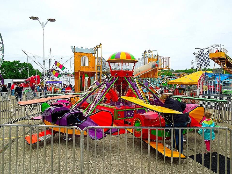 Red Baron airplane kiddie ride at a carnival — kids ride rental for school carnivals Los Angeles